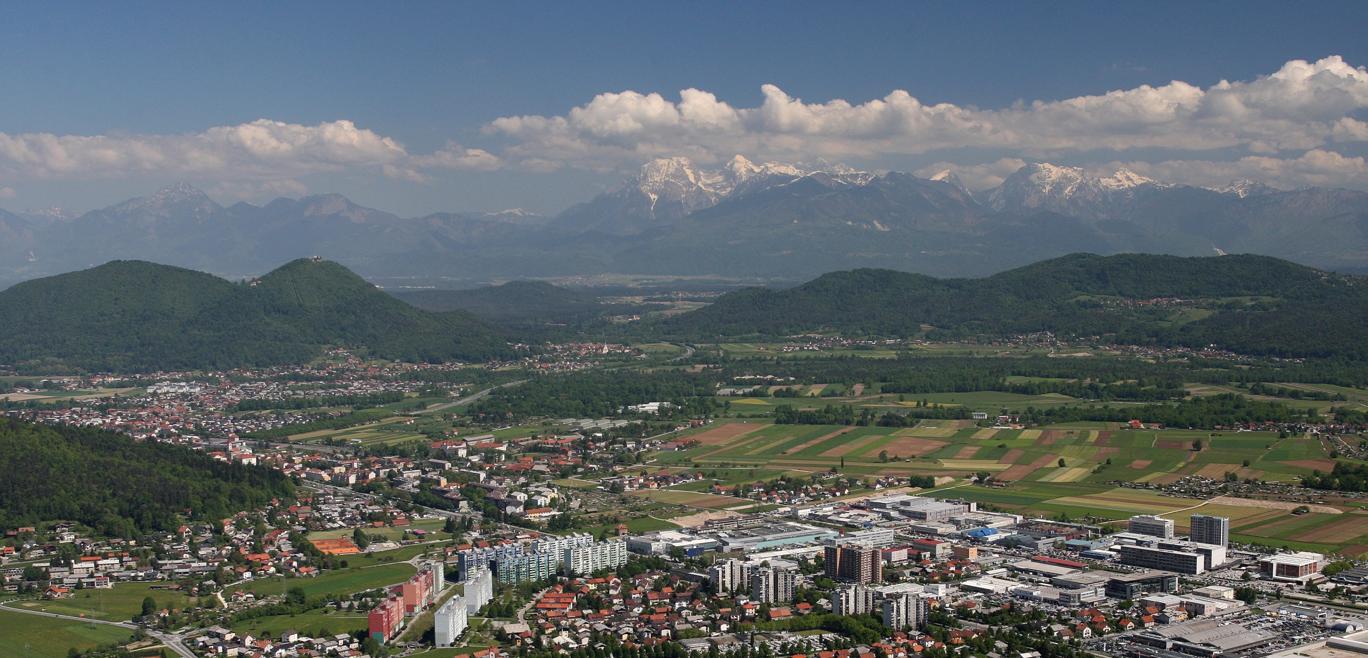 Lubljana Dravlje with snow capped Alps behind